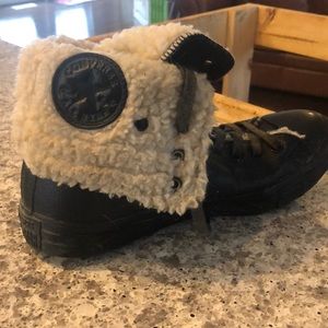 Black, lace up Converse All Star, high tops. Faux sheep lined, size 9.